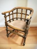 A beech elbow chair with lattice back rest, width 56 cm.