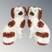 A pair of Staffordshire spaniels, height 25 cm.