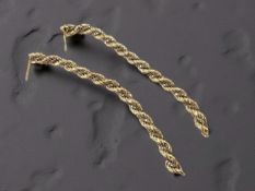 A pair of 18ct gold two-tone ropetwist earrings, lacking post fittings, length 8cm.