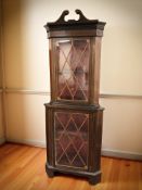A 19th century mahogany and satinwood inlaid standing corner cabinet, height 230 cm.
