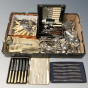 A quantity of boxed and loose cutlery, napkin rings, etc.