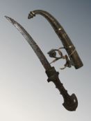 An Arabic jambiya knife in decorative sheath, length 41 cm.