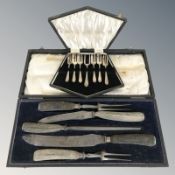 An antler handled carving set, and a further set of EPNS forks in boxes.