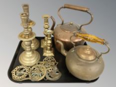 A Victorian copper kettle, brass kettle, brass candlesticks and horse brasses.