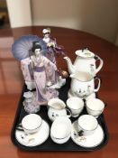 Fourteen pieces of Royal Winton tea china, and two Franklin Mint porcelain figures.