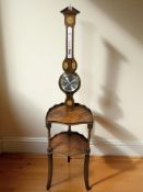 A reproduction mahogany two tier occasional table and an inlaid mahogany barometer.