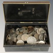 A tin of mixed pre-decimal and other coins.