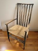 A beech rush seated low chair with wavy spindle back, width 50 cm.