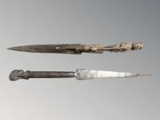 Two African carved hardwood spears, length 91 cm.