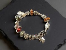 Pandora : A silver charm bracelet, length 20cm, boxed.