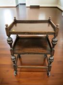 An early 20th century mahogany two tier serving trolley on castors, width 64 cm.
