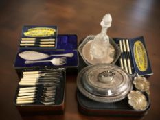 A group of boxed EPNS and stainless steel cutlery, an EPNS entree dish, an etched glass decanter,