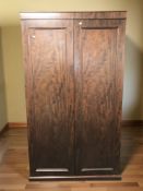 A 20th century mahogany double door compactum wardrobe, 108 cm x 61 cm x 189 cm.