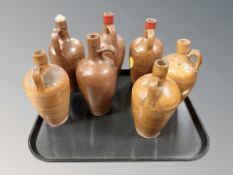 A group of glazed stoneware bottles / flagons.