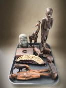 A group of African carved wooden animals, a carved soapstone bust of a man by J Masanga,