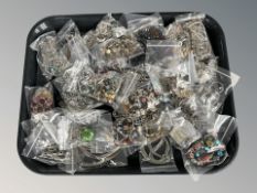 A large quantity of modern costume jewellery, charm bracelets, necklaces, etc.