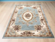 A machine made carpet of French design, 282 cm x 200 cm.