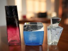 Three perfume factice bottles comprising Aramis Life, Eau de Star and Hugo Boss Intense,