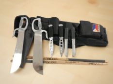 A group of oriental knives.