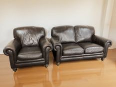 A contemporary brown leather three piece lounge suite comprising of two two seater settees,