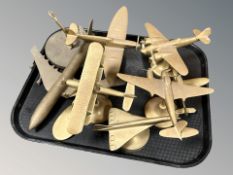 A group of cast brass scale model aircraft.