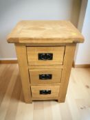 A modern oak three drawer bedside stand, width 45 cm.