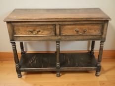 A 19th century oak two drawer side table, 120 cm x 42 cm x 88 cm.