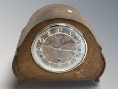 An Art Deco oak mantel clock, height 22 cm.
