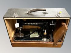 A Singer sewing machine, in box.
