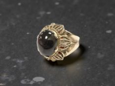 A 9ct gold cabochon garnet dress ring, size N. CONDITION REPORT: Gross weight: 7.2g.