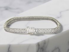 An 18ct gold diamond bracelet, set with approximately 270 diamonds totalling 4.