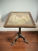 A mahogany tripod occasional table with tapestry top, height 66 cm.