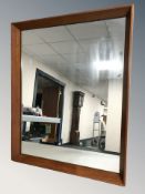 A teak framed mirror, 54 cm x 44 cm.