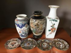 A group of oriental ceramics including a Satsuma export baluster vase on blue ground, height 31 cm,