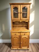 A modern pine kitchen dresser, 77 cm x 46 cm x 178 cm.