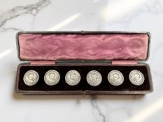 A set of six large Edwardian silver buttons,