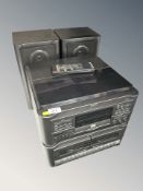 A Sharp hi-fi system, speakers, remote.