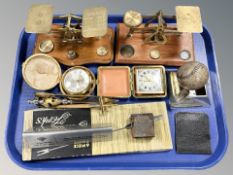 Two sets of brass postal scales with various weights, golfing themed ashtray, letter knives,