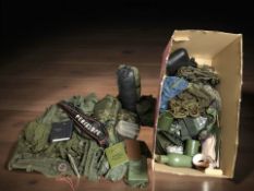 A quantity of military / camping supplies, camouflage items, canteens, etc.