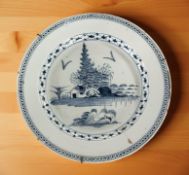 A 19th century Chinese blue and white tin glazed charger, diameter 34 cm.