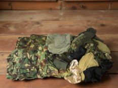 A group of military clothing, woolen jumpers, camouflage pattern items, etc.