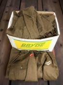 A group of military uniforms, some for the Grenadier Guards.