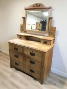 An Edwardian satinwood four drawer dressing chest, 106 cm x 50 cm x 166 cm.