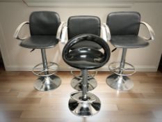 A set of three chrome rise and fall swivel bar chairs, plus another similar.