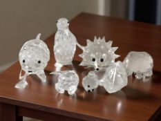 A small group of Swarovski crystal animal ornaments.
