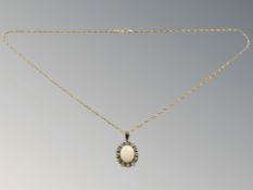 A 9ct gold opal cluster pendant,