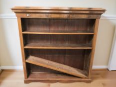 An early 20th century continental walnut and pine open bookcase, 141 cm x 30 cm x 141 cm.