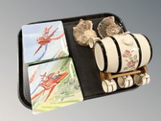 Two ammonite fossil specimens, ceramic whisky keg and set of mugs on stand,