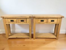A pair of modern oak two drawer side tables, 91 cm x 30 cm x 81 cm.
