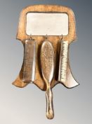 An oak wall mirror and brush set, mirror 39 cm high.